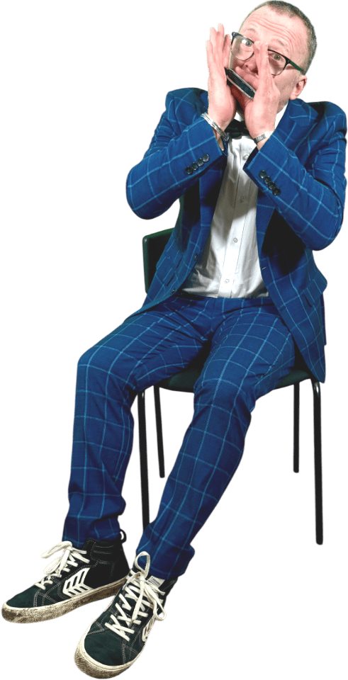 Motta Musician playing the harp in his funky blue suit and black trainers